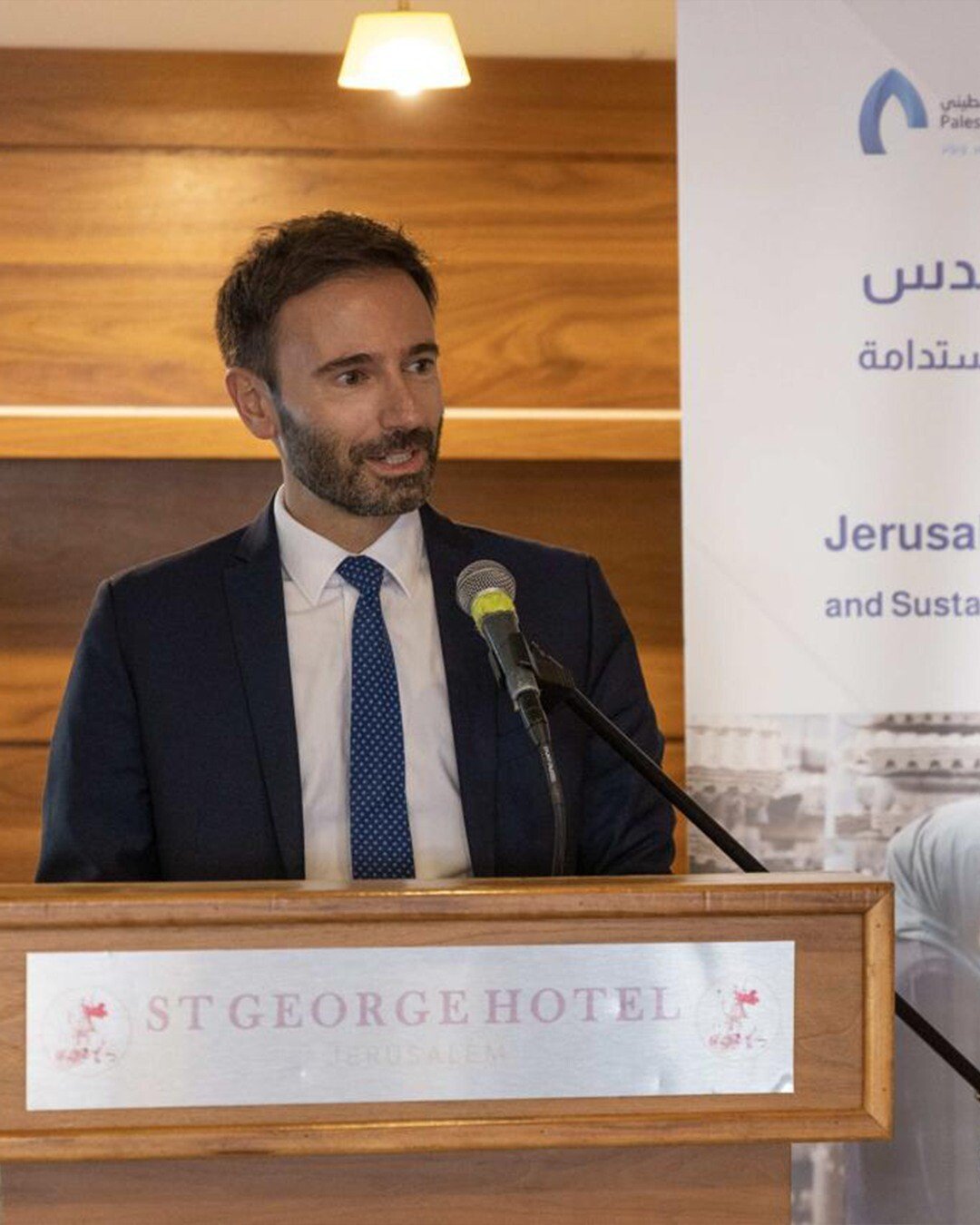 A speaker addressing the Jerusalem Green Energy closing ceremony